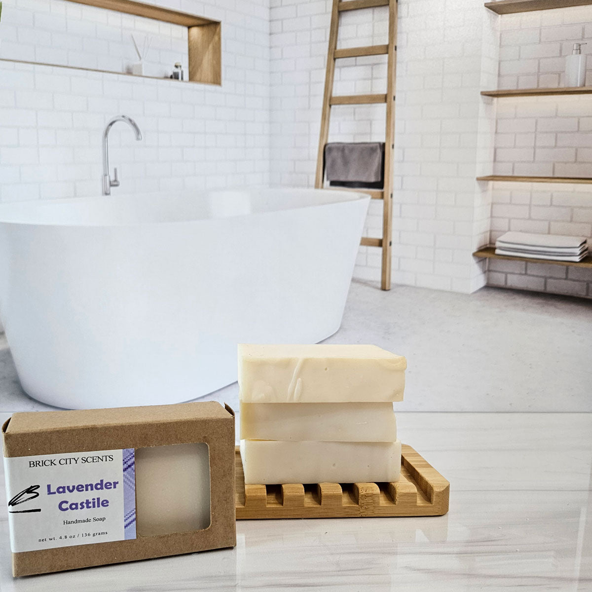 Brick City Scents Lavender Castile handmade soap bars stacked on a bamboo tray, with product box.