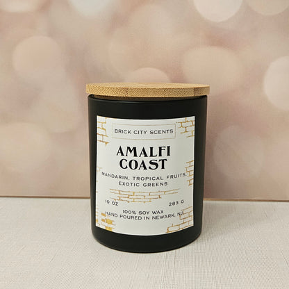 Brick City Scents Amalfi Coast candle in a black jar with a wooden lid. Scent notes: mandarin, tropical fruits, exotic greens.