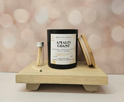 Brick City Scents Amalfi Coast candle in a black jar with matches and a bamboo lid.