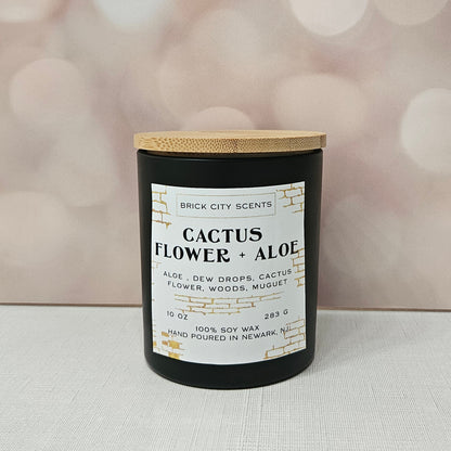 Brick City Scents Cactus Flower + Aloe candle. 10 oz soy wax candle in a black jar with wood lid.