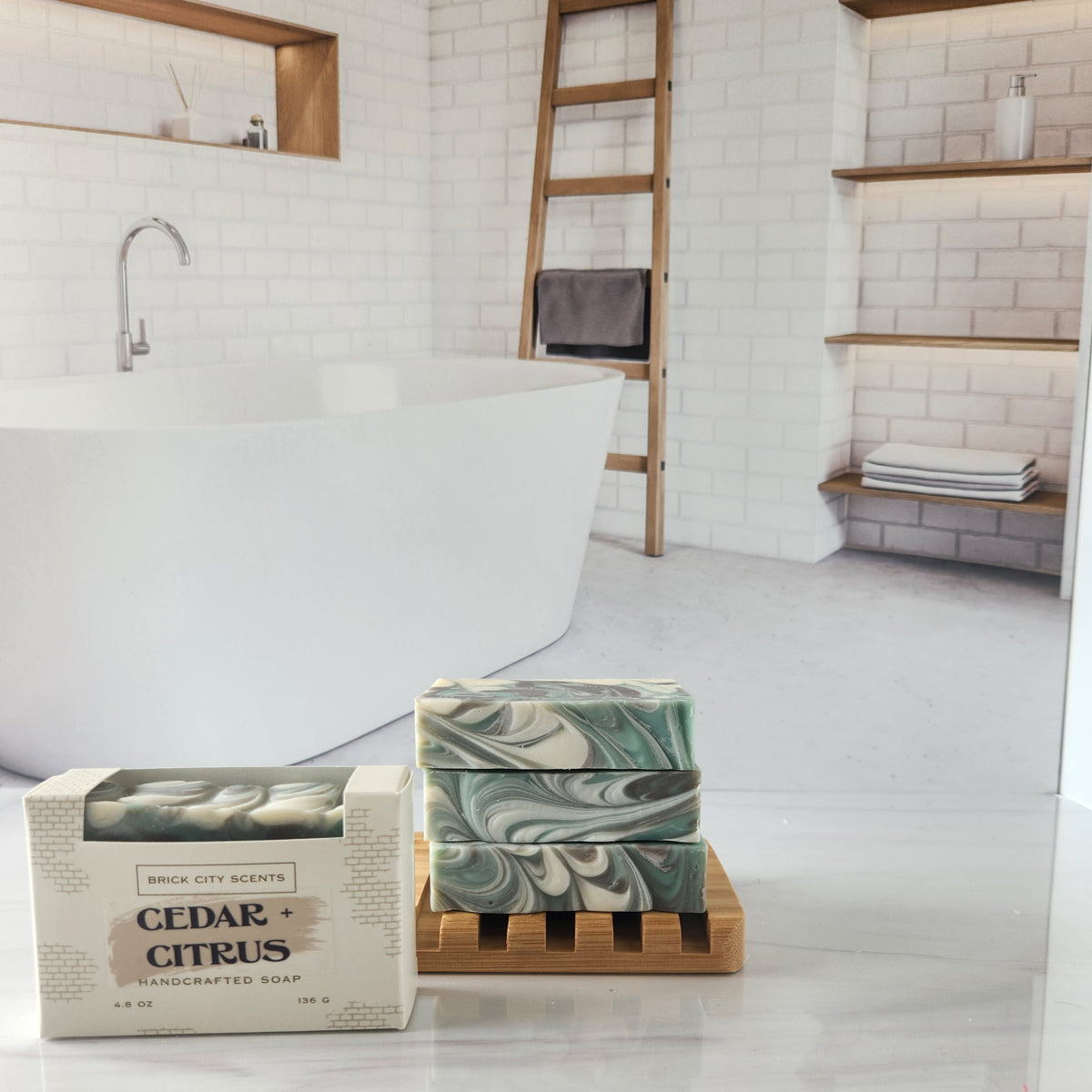 Brick City Scents cedar citrus handcrafted soap bars stacked on a wooden soap dish.