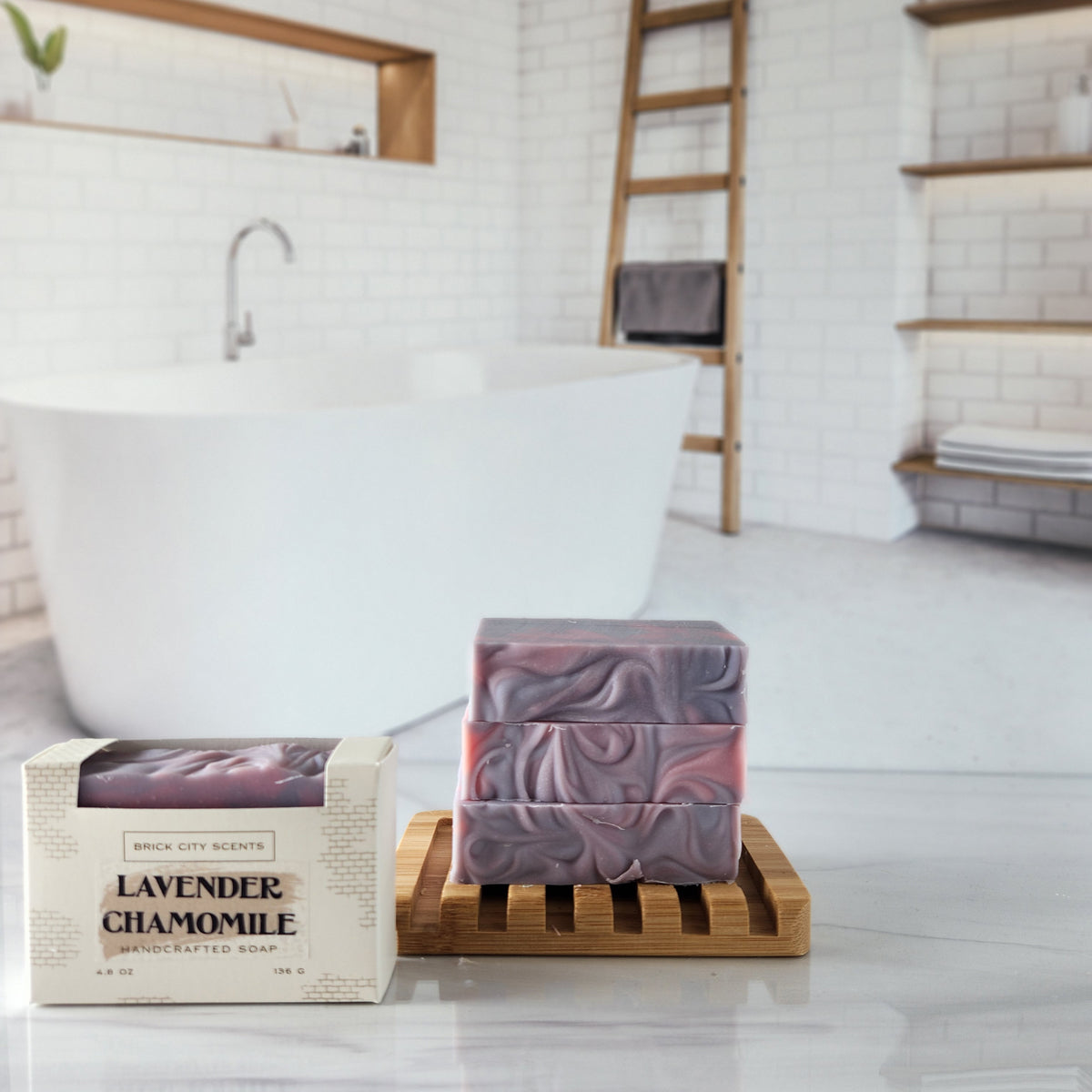 Handcrafted lavender chamomile soap bars stacked on a wooden holder. Recyclable packaging visible.