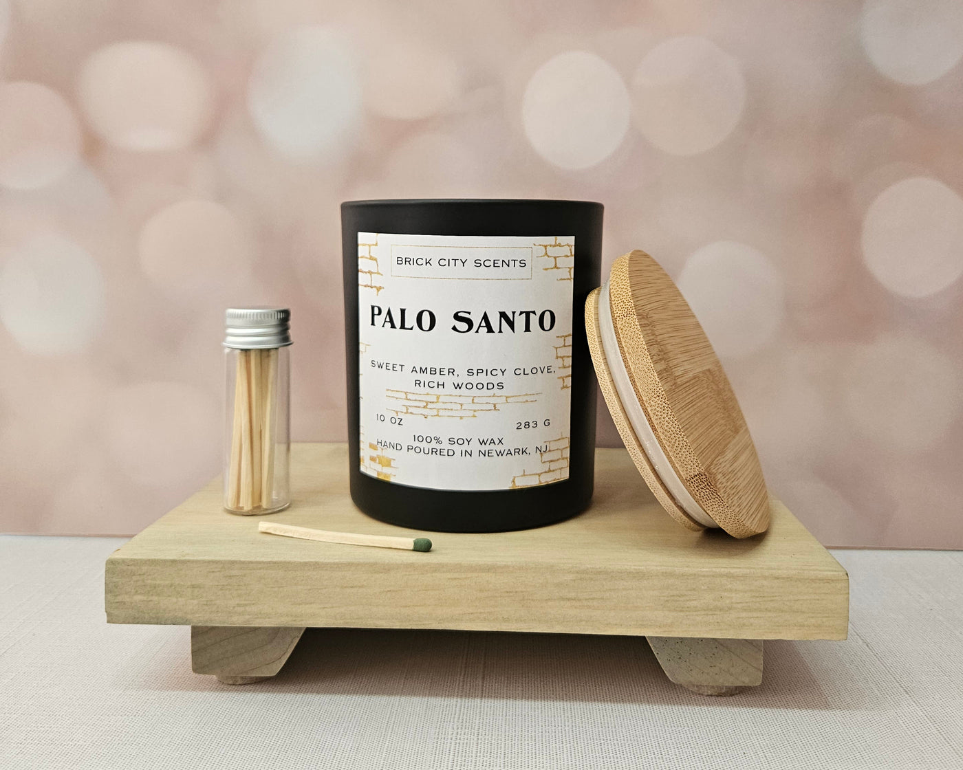Brick City Scents Palo Santo candle, 10oz soy wax, sweet amber and spicy clove scent, with wood lid and matches.