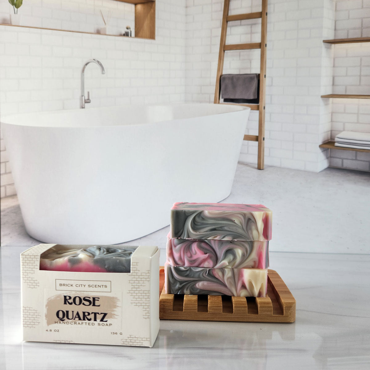 Brick City Scents Rose Quartz handmade soap bars, stacked on a wooden holder with product packaging.