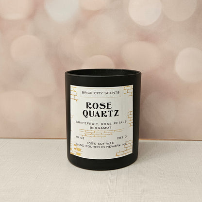Brick City Scents Rose Quartz candle in a black jar. Scented with grapefruit, rose petals, and bergamot. 10 oz, 100% soy wax.